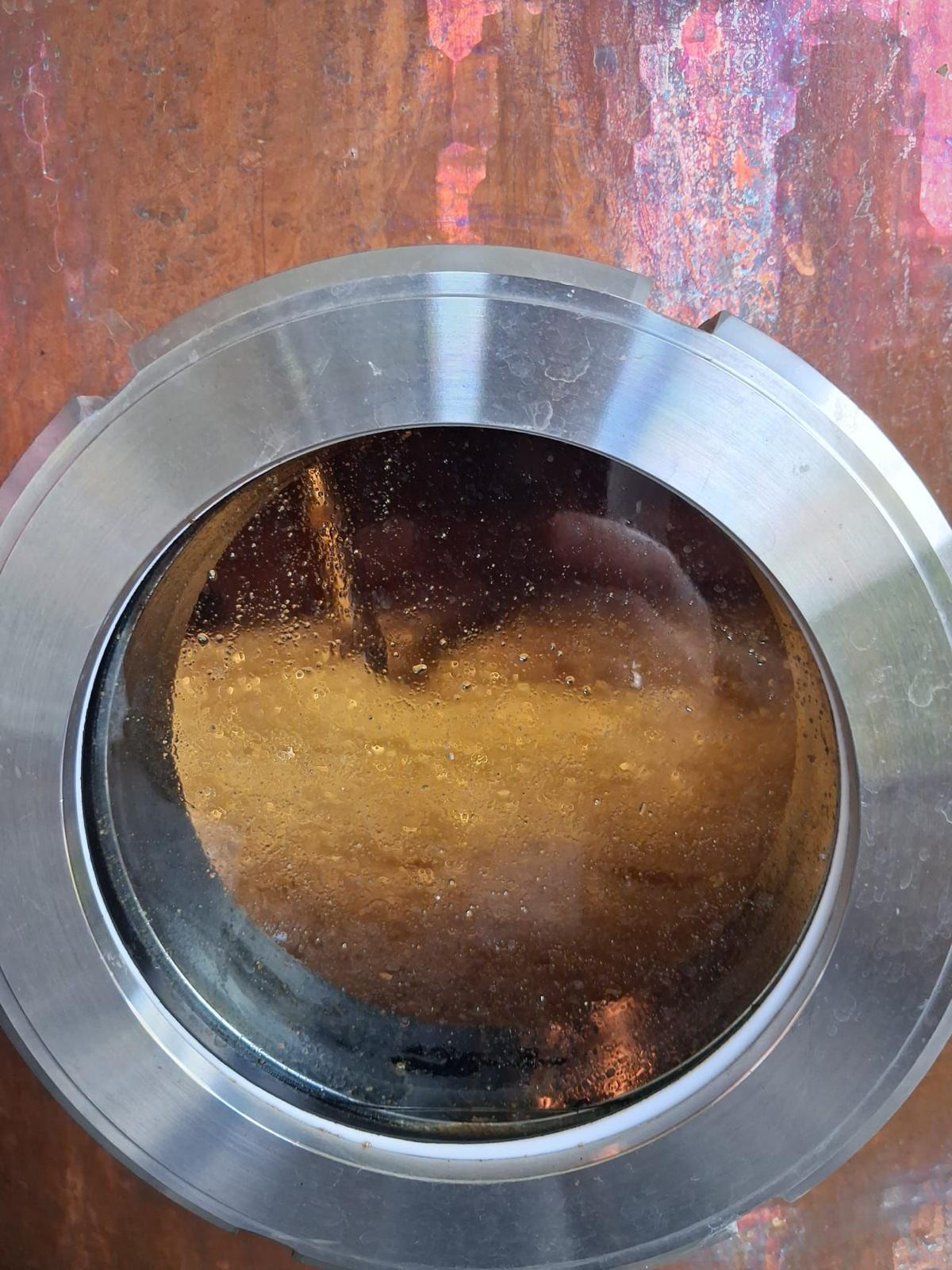 Copper still — the cut, seen through the sight glass